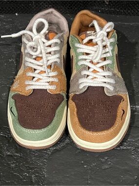 Jordan 1 Retro Low OG Zion Williamson Voodoo sneakers in a brown colorway.